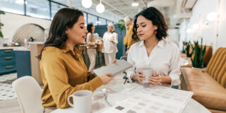 Two women discussing business or retail space