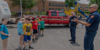 Firefighters instructing students