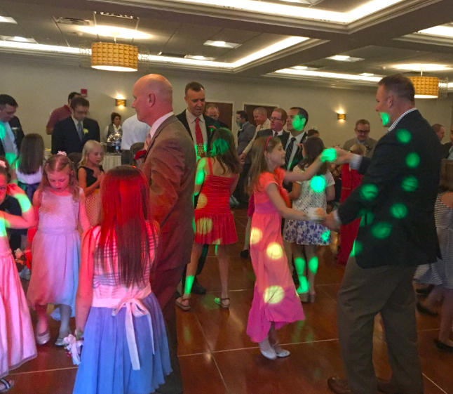 Girls dancing with their dads