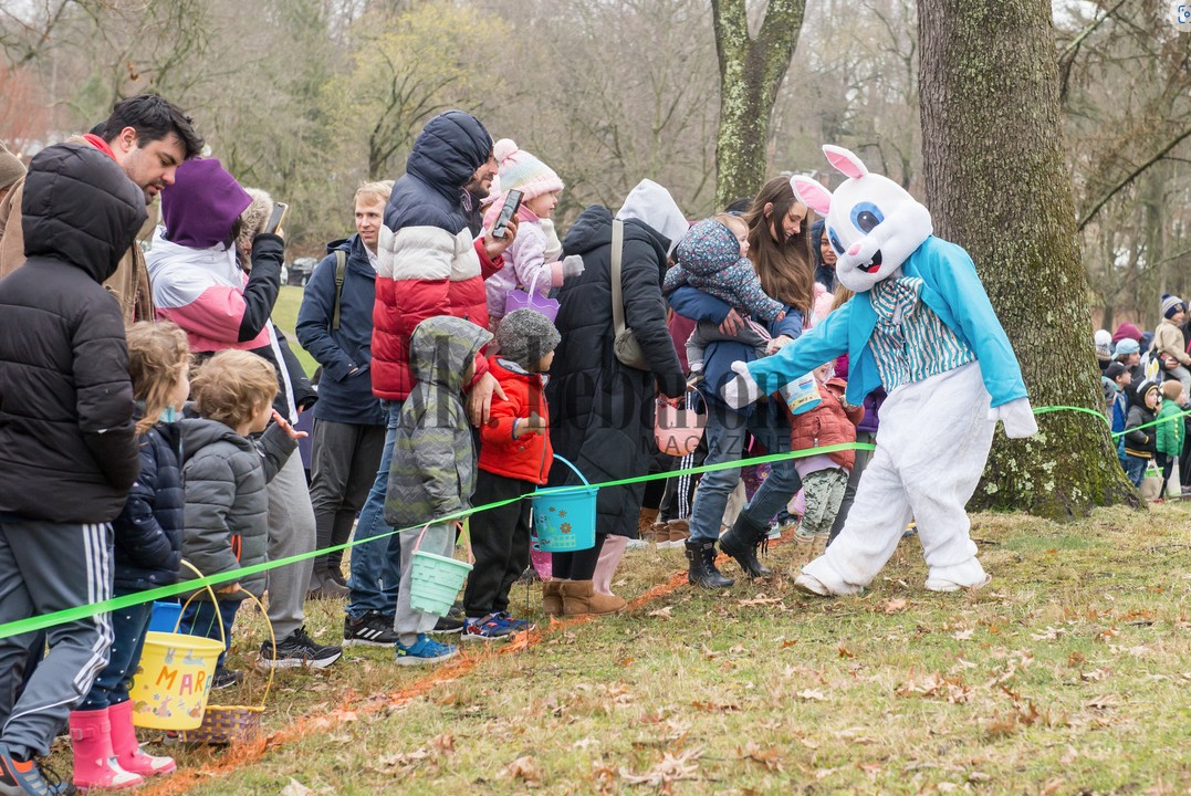 Bunny greets young community members awaiting the Egg Hunt