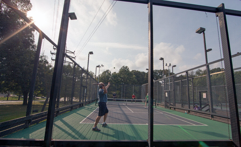 A closeup of children playing platform tennis