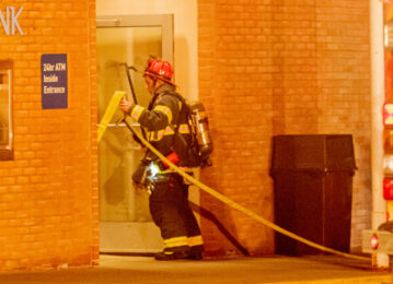 Mt. Lebanon Fire Department firefighter brings equipment into incident location