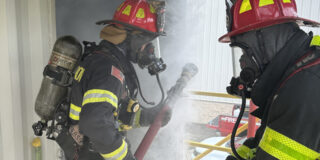 Two firefighters training.